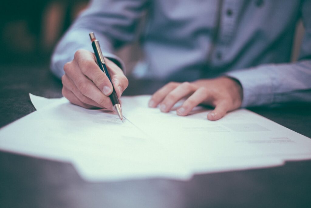 Family Reviewing Insurance Documents For Aba Therapy Coverage In Texas - Harmony ABA Centers